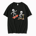 Officials Two Cartoon Skeletons Riding Orange Skateboard And Kick Scooter Mens T Shirt Sweater