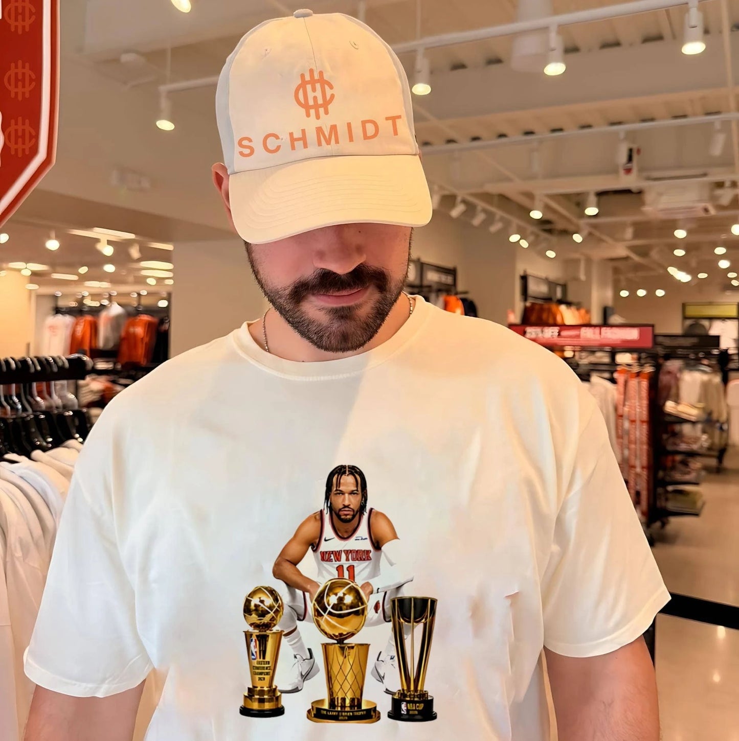 New York Knicks Jalen Brunson sitting beside trophis shirt
