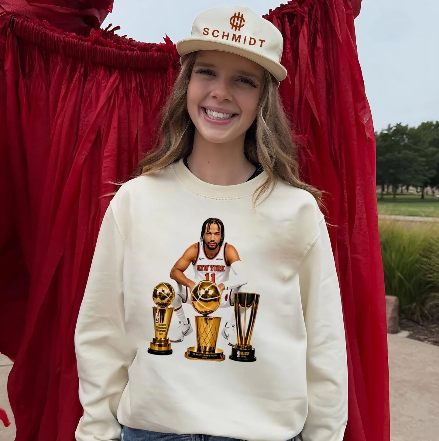 New York Knicks Jalen Brunson sitting beside trophis shirt